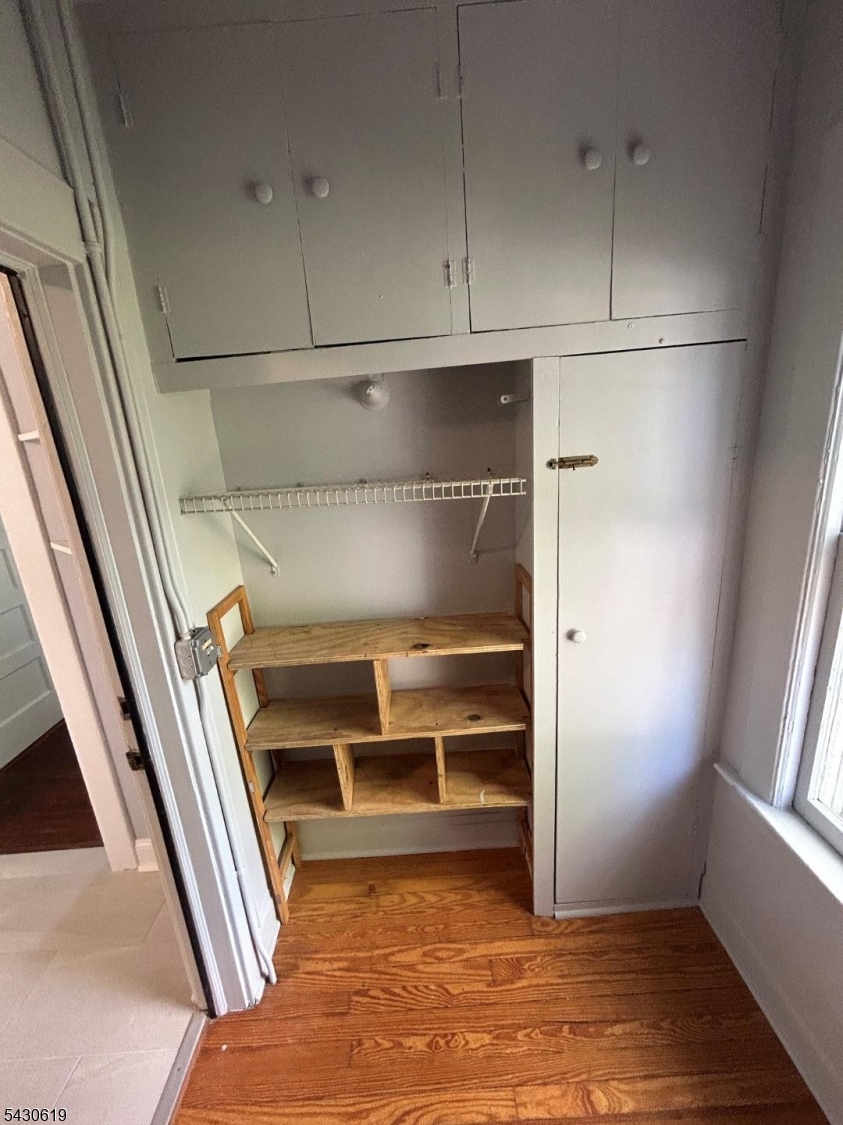 96 Grove Street Montclair, NJ 07042 - Photo 21 of 23 a view of walk in closet with empty racks
