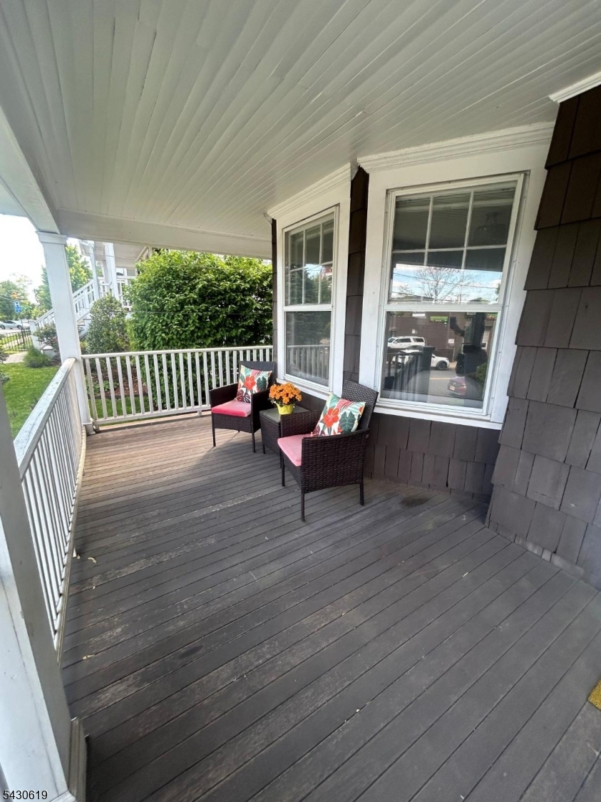 96 Grove Street Montclair, NJ 07042 - Photo 22 of 23 a backyard of a house with wooden floor and outdoor seating