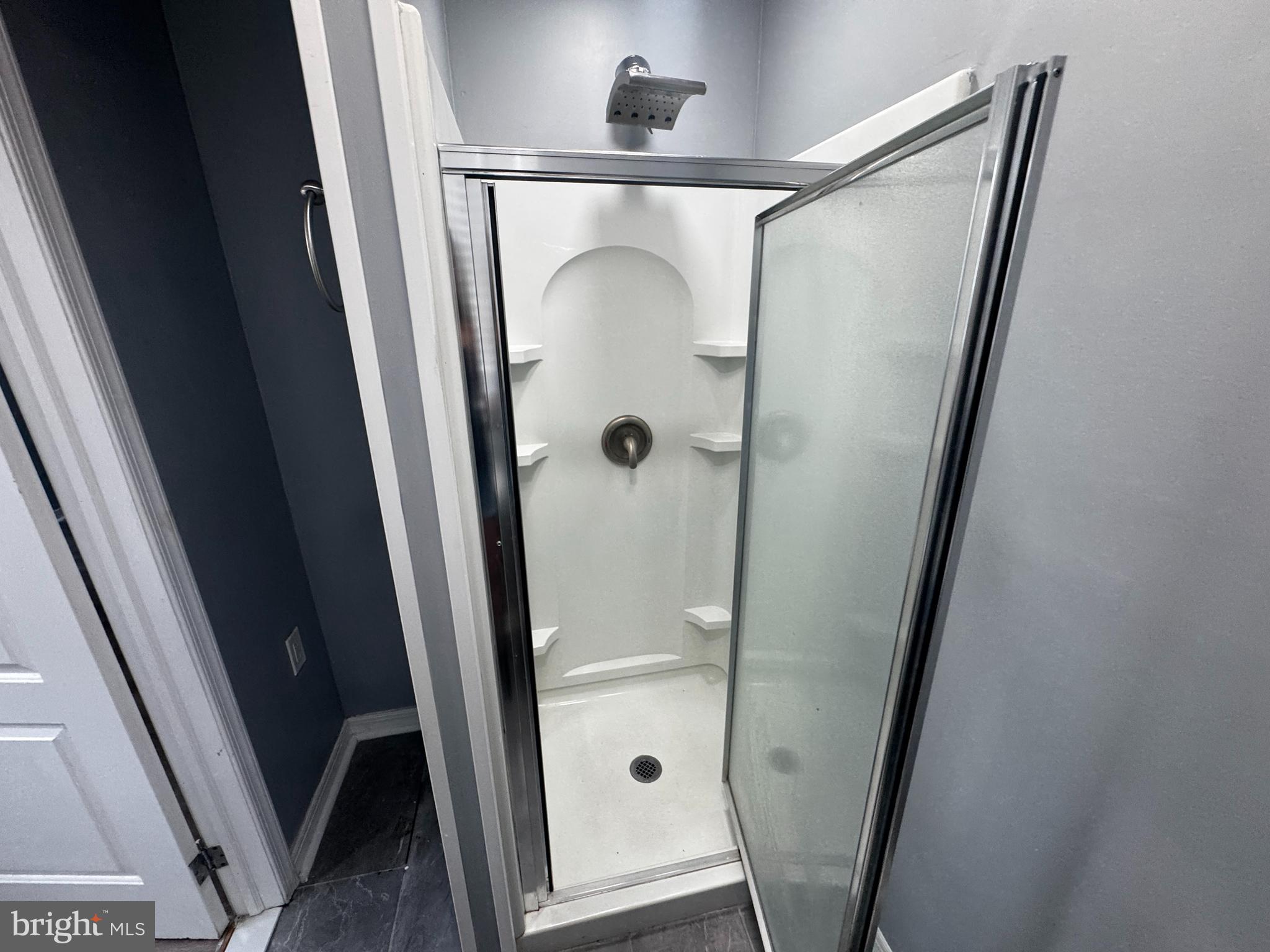 700 Lloyd Street Chester, PA 19013 - Photo 26 of 32 a bathroom with a glass door shower and vanity