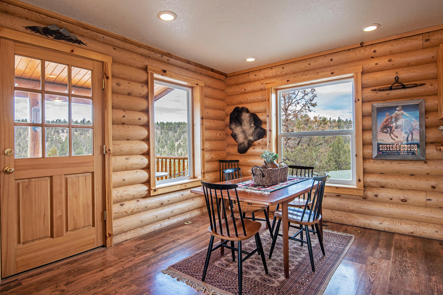 70700 Holmes Road Sisters, OR 97759 - Photo 13 of 53 Main floor has wood laminate plank flooring throughout.