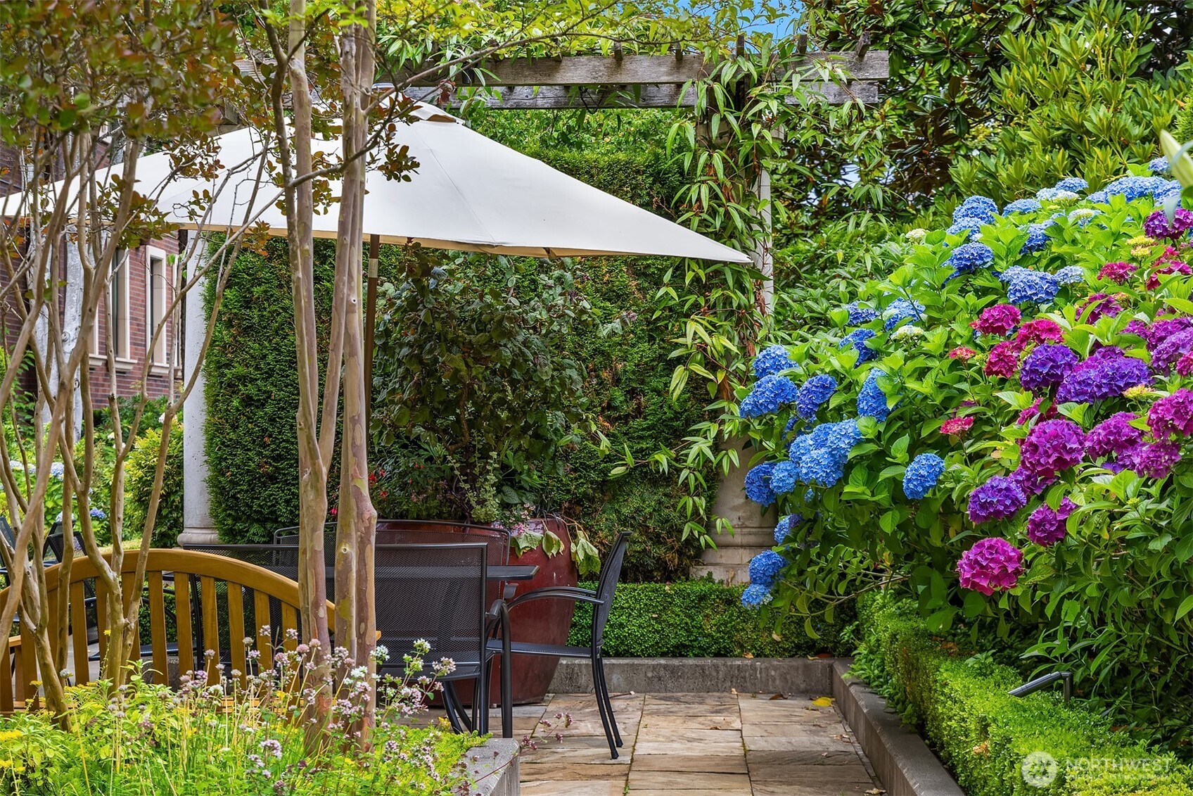 1168 Harvard Avenue East, Unit P7 Seattle, WA 98102 - Photo 23 of 24 a view of a garden with plants and large trees