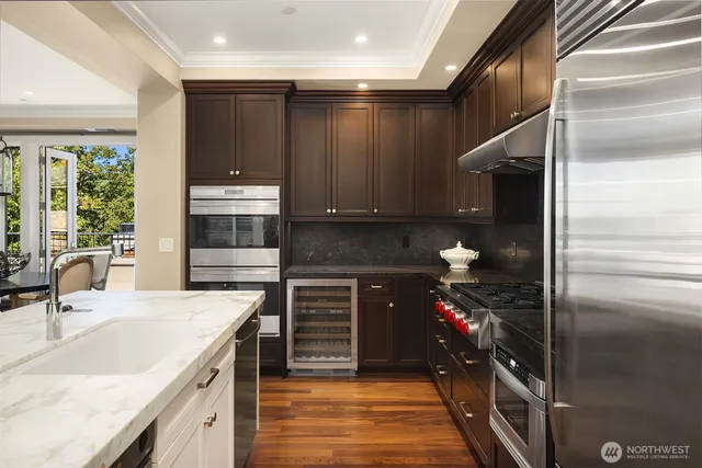 a kitchen with a refrigerator and a sink