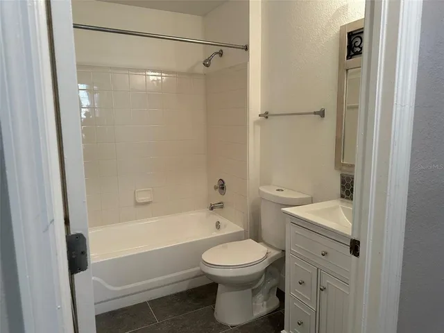 a bathroom with a sink a toilet and a bathtub