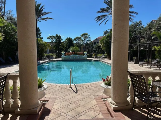 a view of a swimming pool with a patio