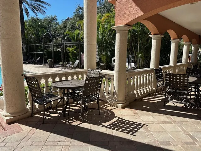 a view of a patio with table and chairs with wooden floor