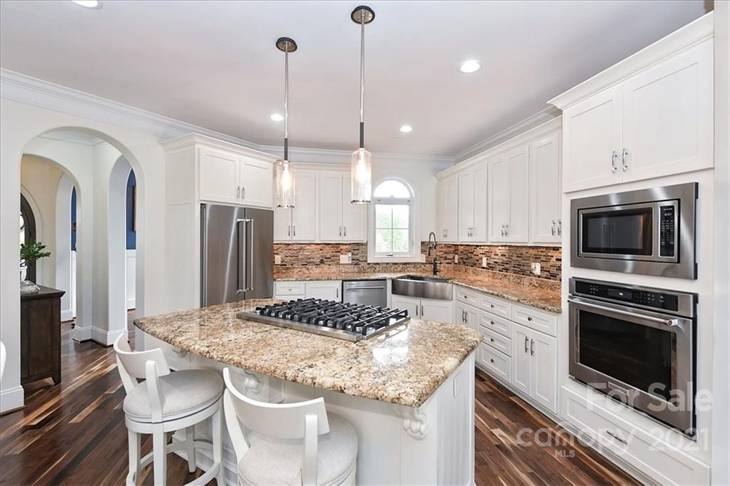 3425 Millstone Creek Road Lancaster, SC 29720 - Photo 16 of 48 a kitchen with stainless steel appliances granite countertop a stove a sink a microwave a refrigerator and cabinets