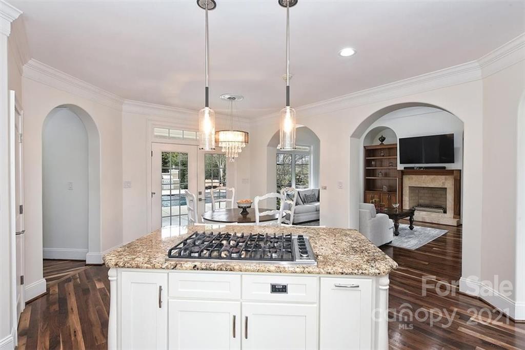 3425 Millstone Creek Road Lancaster, SC 29720 - Photo 18 of 48 a kitchen with a stove a sink a counter space and a view of living room