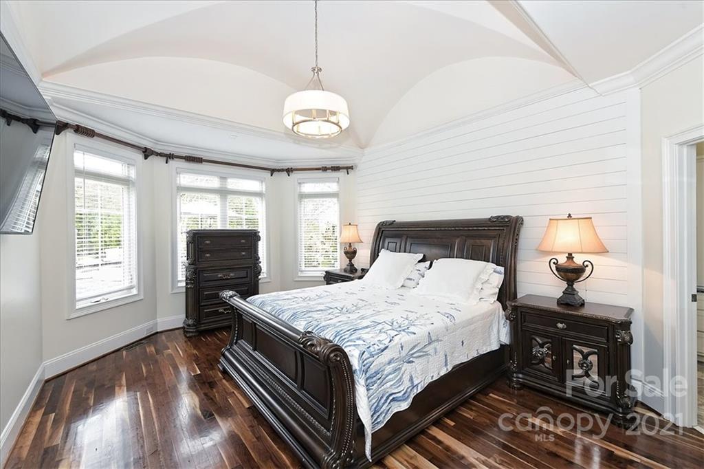 3425 Millstone Creek Road Lancaster, SC 29720 - Photo 20 of 48 a bedroom with a bed and a chandelier