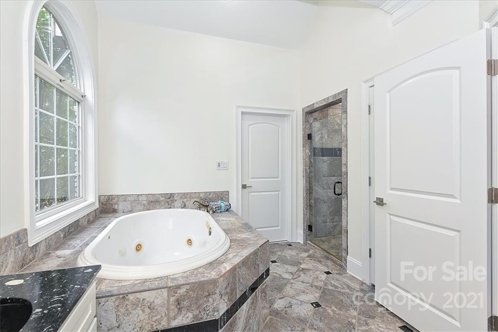 3425 Millstone Creek Road Lancaster, SC 29720 - Photo 24 of 48 a white bath tub sitting in a spacious bathroom