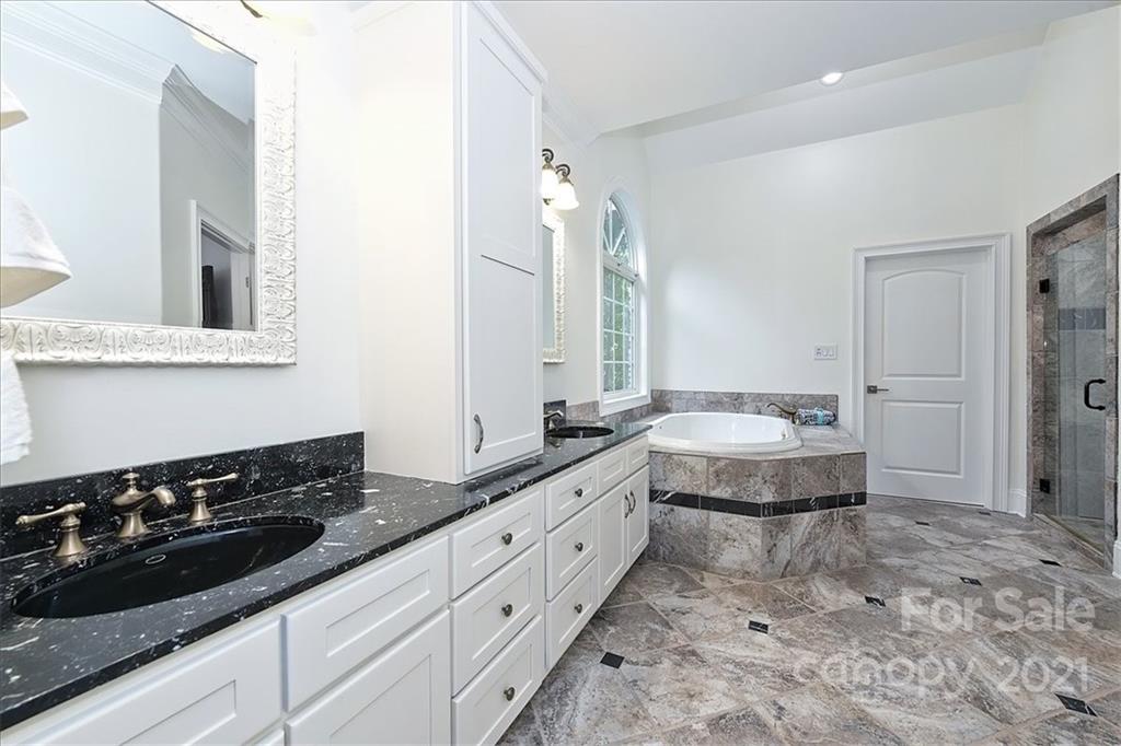 3425 Millstone Creek Road Lancaster, SC 29720 - Photo 25 of 48 a spacious bathroom with a sink and a large mirror