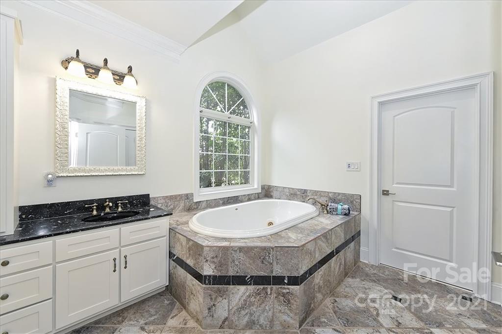 3425 Millstone Creek Road Lancaster, SC 29720 - Photo 27 of 48 a spacious bathroom with a tub and a window