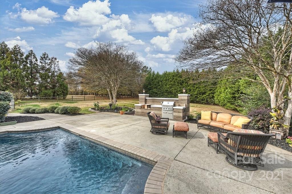 3425 Millstone Creek Road Lancaster, SC 29720 - Photo 42 of 48 a view of a patio with table and chairs and potted plants