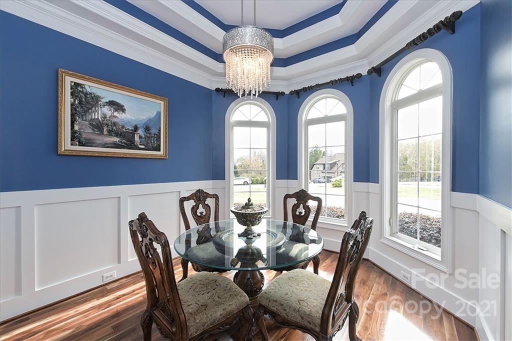 3425 Millstone Creek Road Lancaster, SC 29720 - Photo 8 of 48 a view of a dining room with furniture a chandelier and large windows