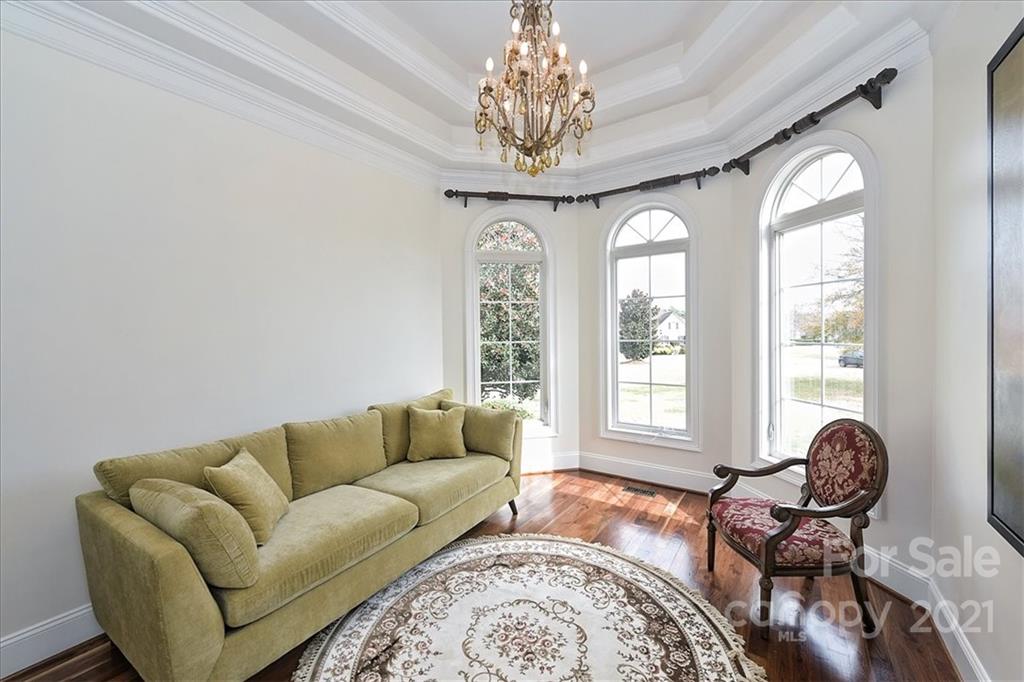 3425 Millstone Creek Road Lancaster, SC 29720 - Photo 10 of 48 a living room with furniture and a chandelier