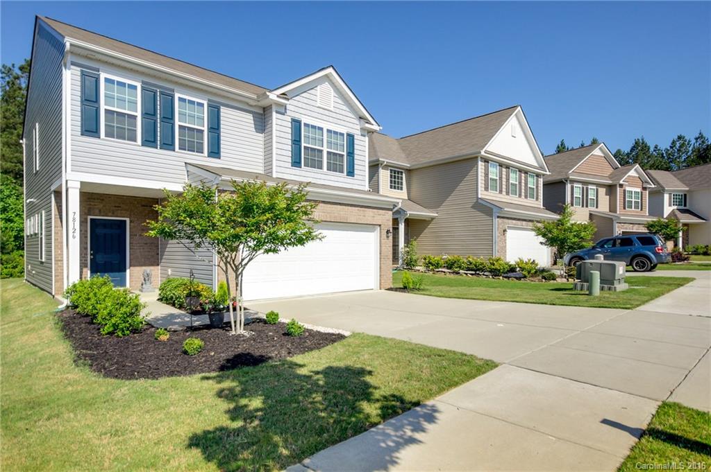 78126 Rillstone Drive, Unit 209 Lancaster, SC 29720 - Photo 1 of 24 a front view of a house with garden