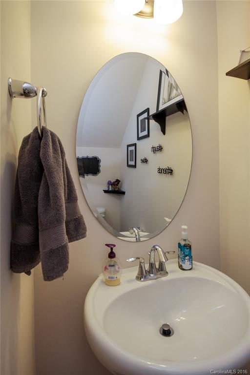 78126 Rillstone Drive, Unit 209 Lancaster, SC 29720 - Photo 2 of 24 a bathroom with a sink and mirror