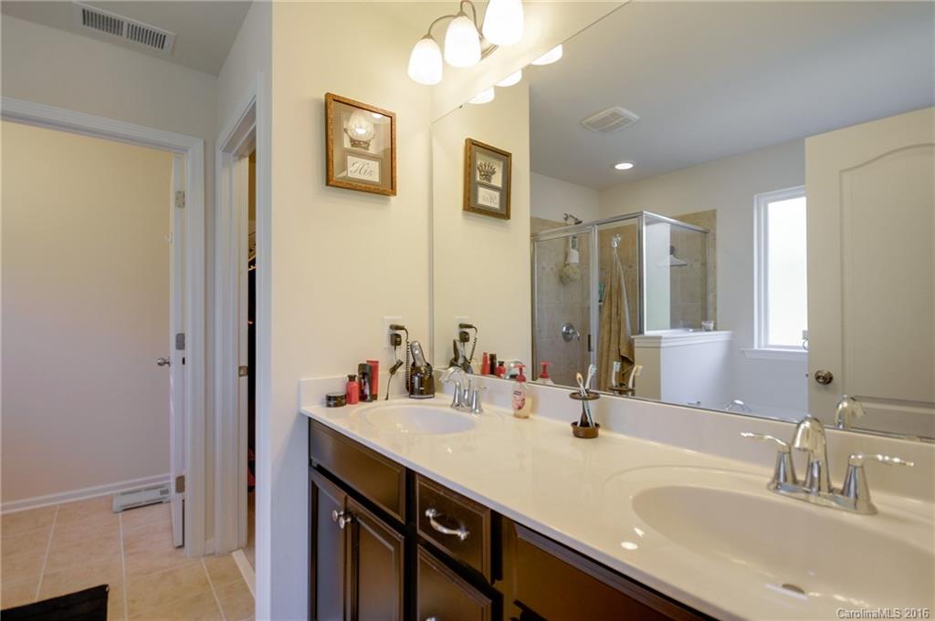 78126 Rillstone Drive, Unit 209 Lancaster, SC 29720 - Photo 15 of 24 a bathroom with a sink double vanity and a mirror