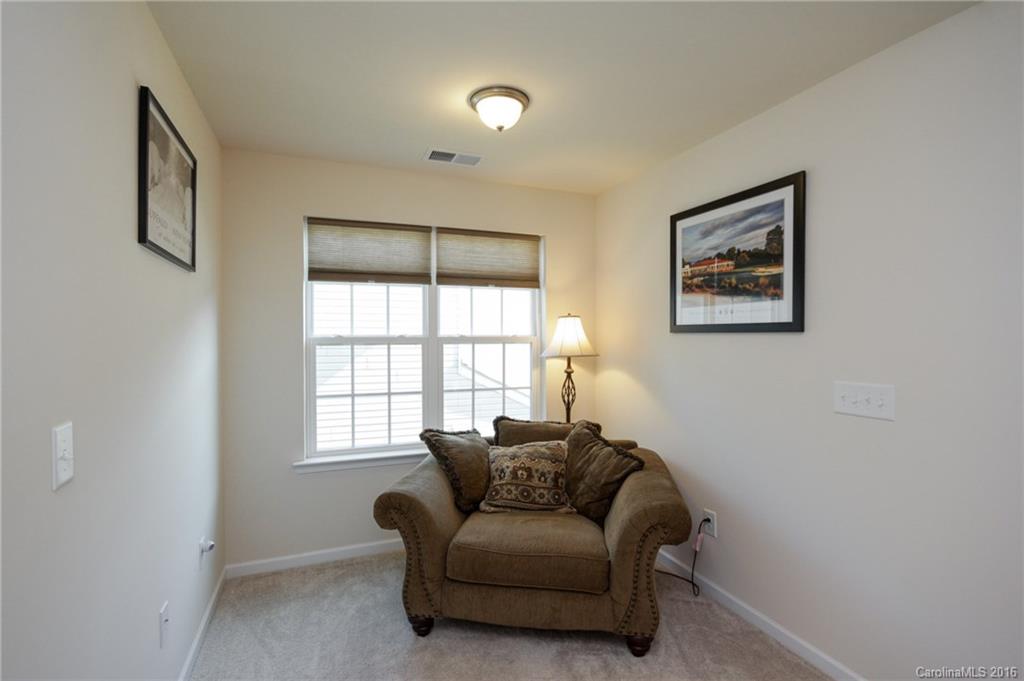 78126 Rillstone Drive, Unit 209 Lancaster, SC 29720 - Photo 16 of 24 a living room with furniture and a window