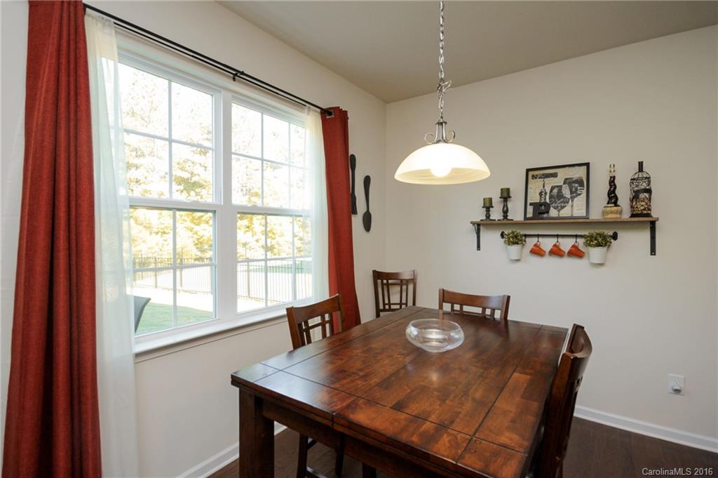 78126 Rillstone Drive, Unit 209 Lancaster, SC 29720 - Photo 4 of 24 a view of a dining room with furniture window and outside view