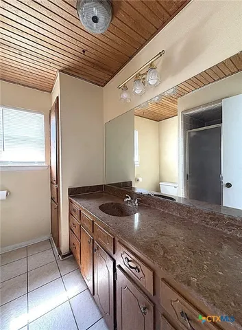 a kitchen with stainless steel appliances granite countertop a sink and a stove