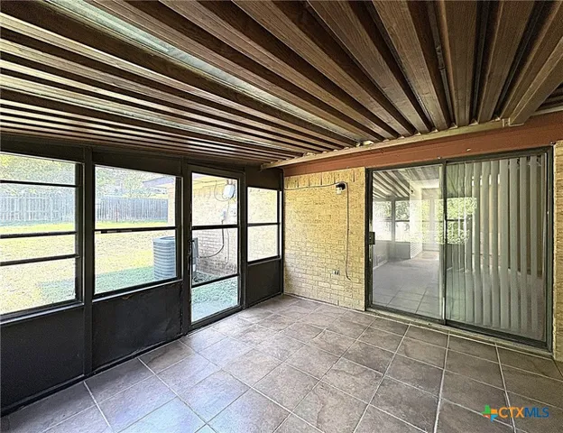 a view of an empty room with a balcony