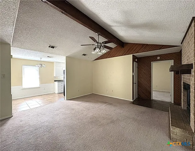 a view of a big room with closet and windows