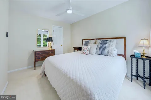 a bedroom with a bed and a table in it