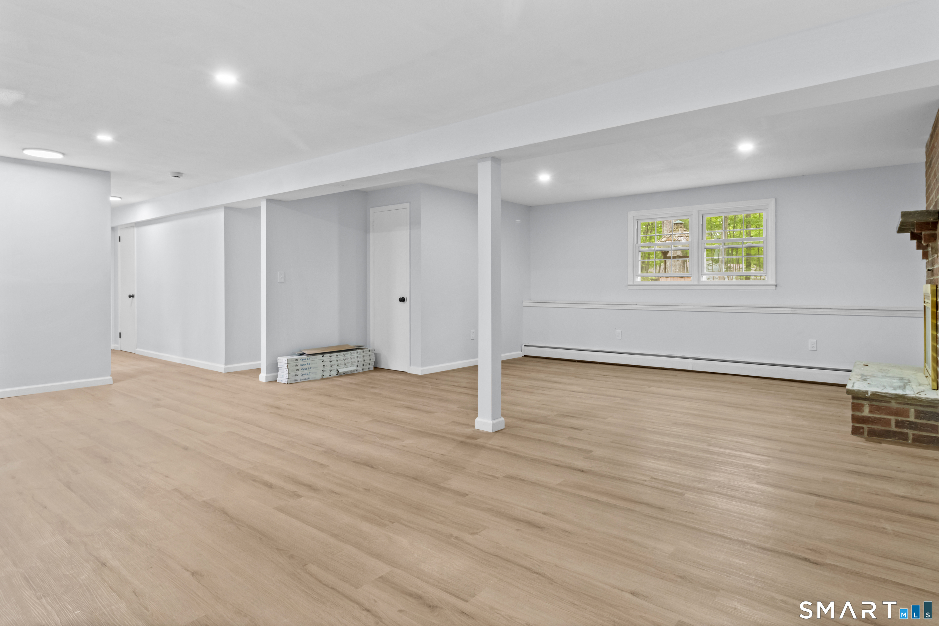 20 Quiet Woods Road East Hampton, CT 06424 - Photo 27 of 40 an empty room with wooden floor and windows