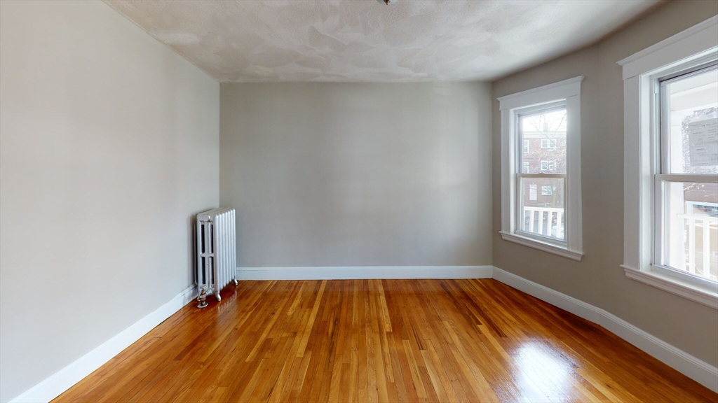5 Edgar Terrace, Unit 2 Somerville, MA 02145 - Photo 5 of 6 a view of wooden floor in a room
