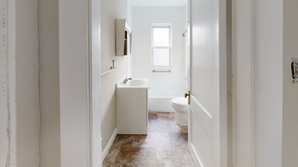 5 Edgar Terrace, Unit 2 Somerville, MA 02145 - Photo 6 of 6 a bathroom with a sink and a toilet