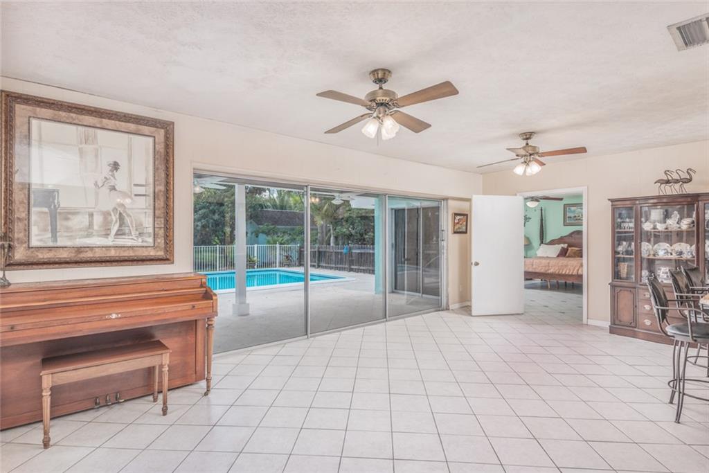 1128 Northwest Fork Road Stuart, FL 34994 - Photo 6 of 23 a view of an empty room with a window