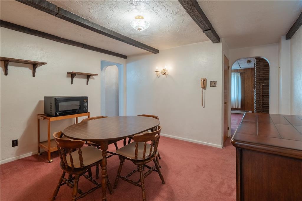 2509 Spring Street Pittsburgh, PA 15210 - Photo 7 of 31 a view of a dining room with furniture and wooden floor