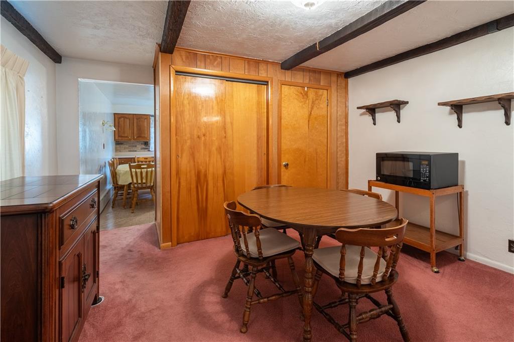 2509 Spring Street Pittsburgh, PA 15210 - Photo 8 of 31 a dining room with furniture and window