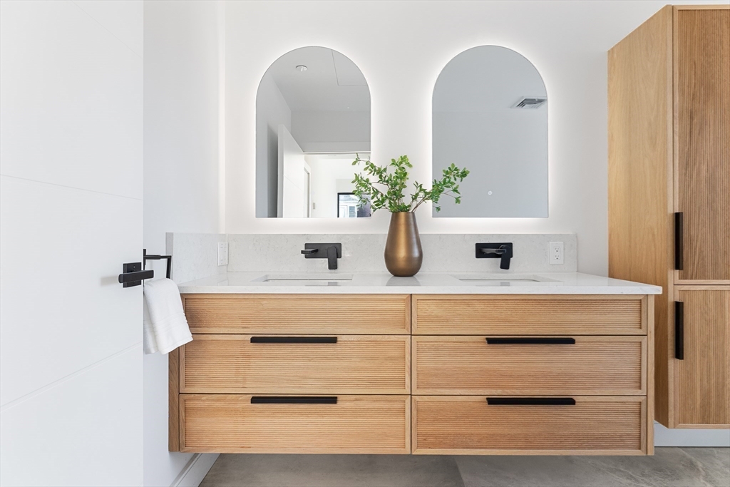 41 University Road, Unit 3 Brookline, MA 02445 - Photo 12 of 21 a bathroom with a sink and a mirror