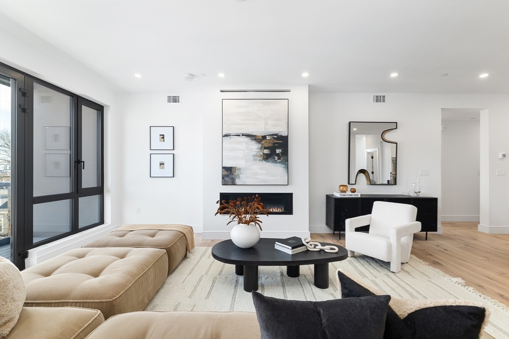 41 University Road, Unit 3 Brookline, MA 02445 - Photo 7 of 21 a living room with furniture and window