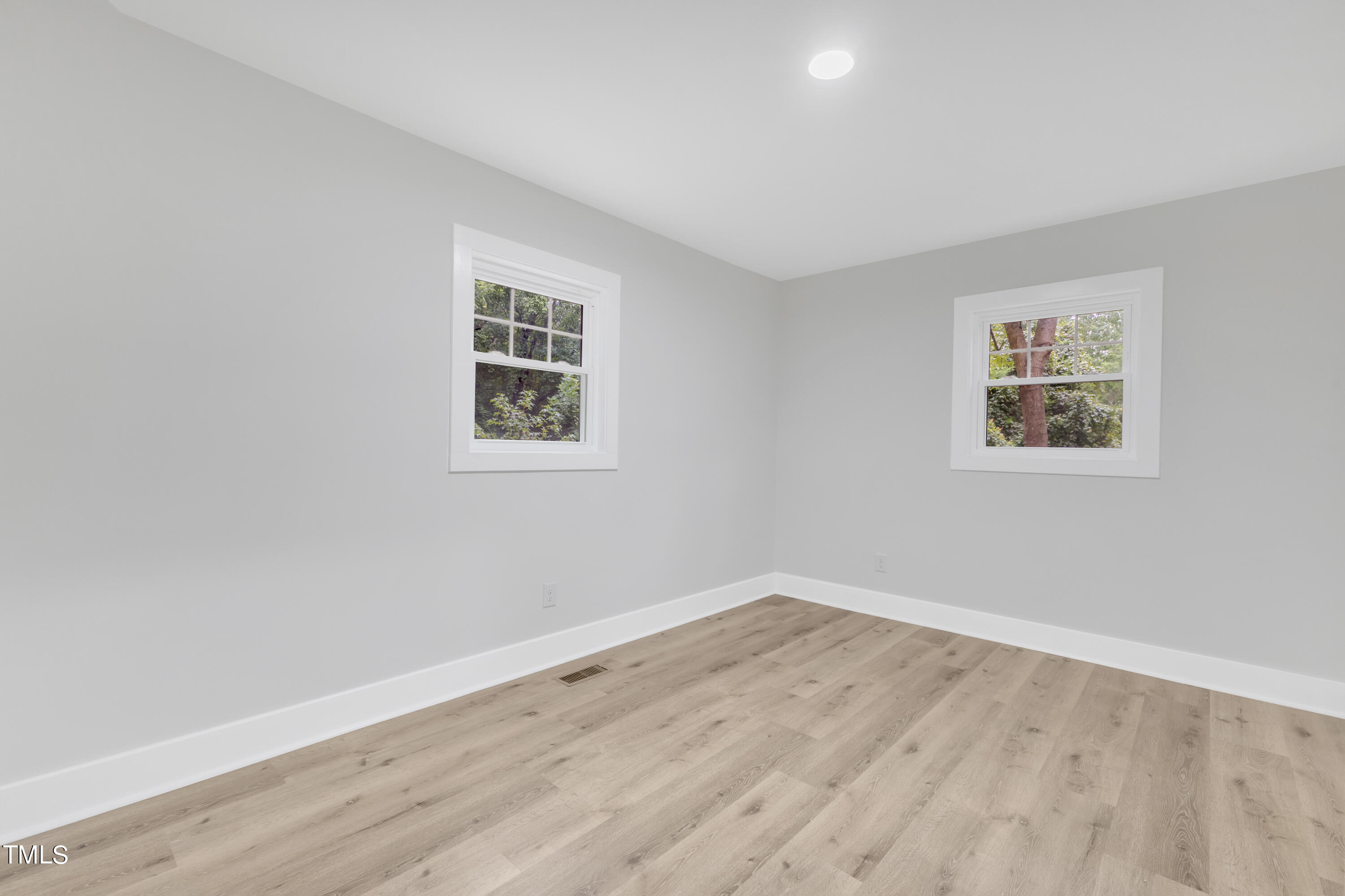 Undisclosed Address Raleigh, NC 27615 - Photo 12 of 26 a view of a room with wooden floor and window