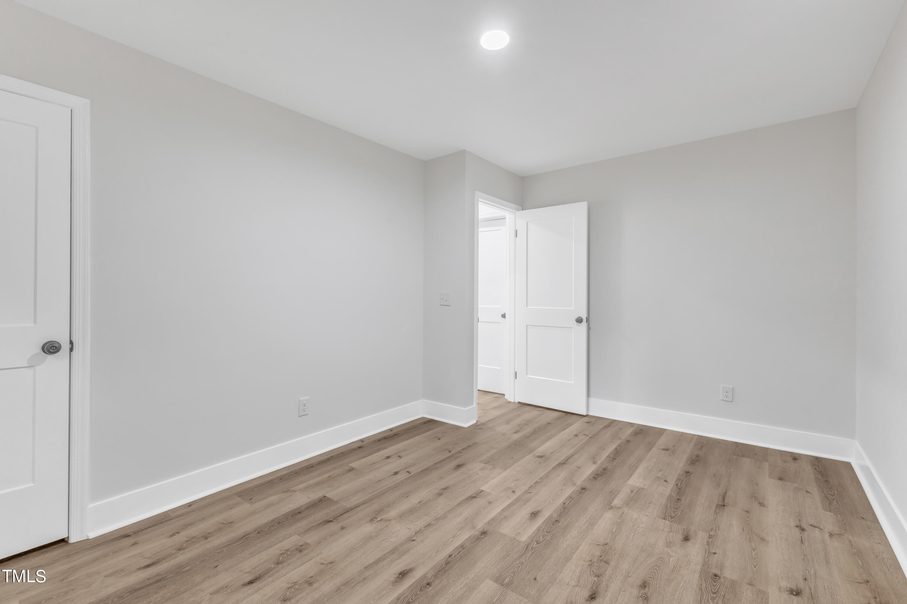 Undisclosed Address Raleigh, NC 27615 - Photo 14 of 26 a view of room with wooden floor