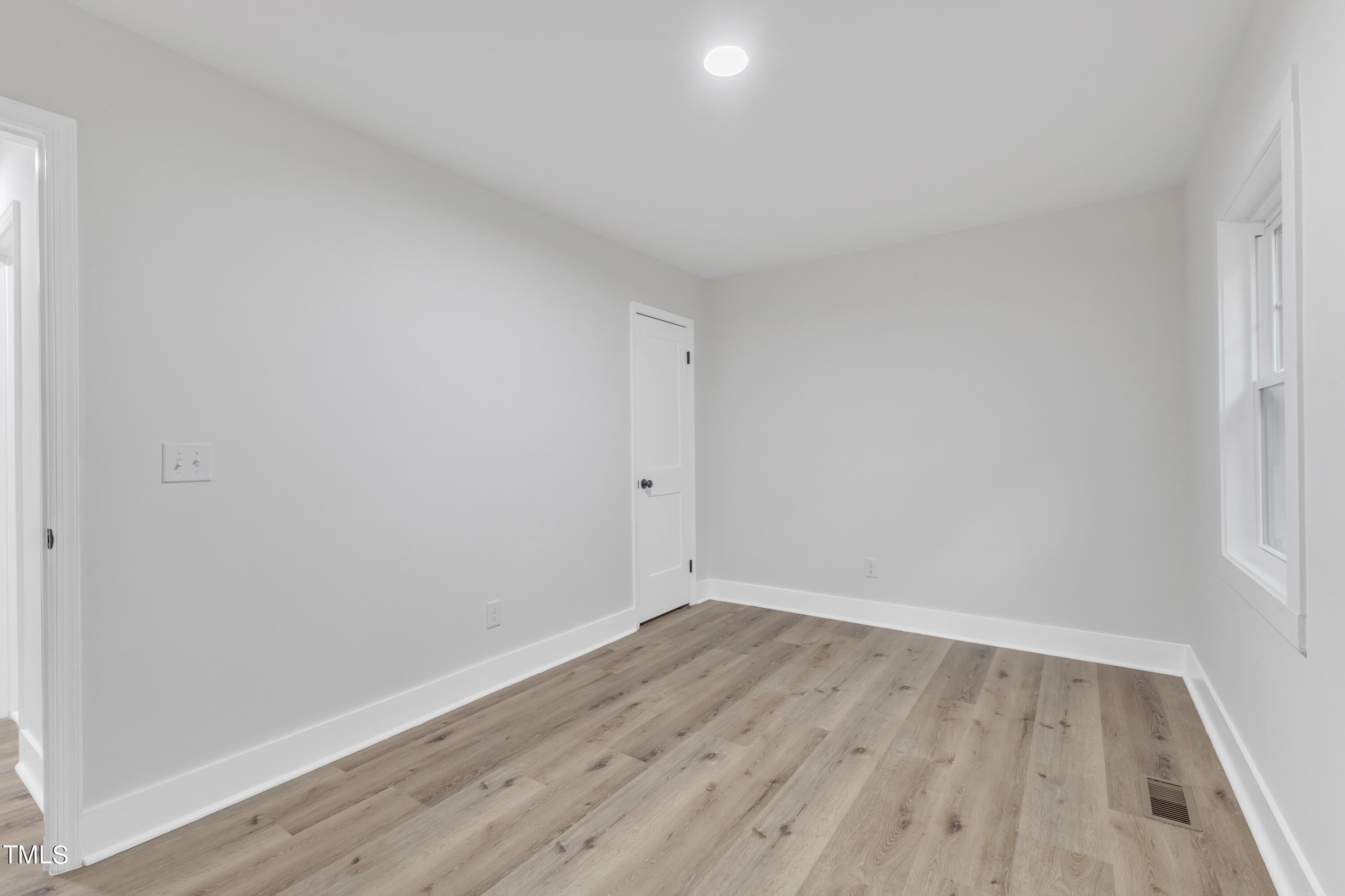 Undisclosed Address Raleigh, NC 27615 - Photo 15 of 26 a view of room with wooden floor