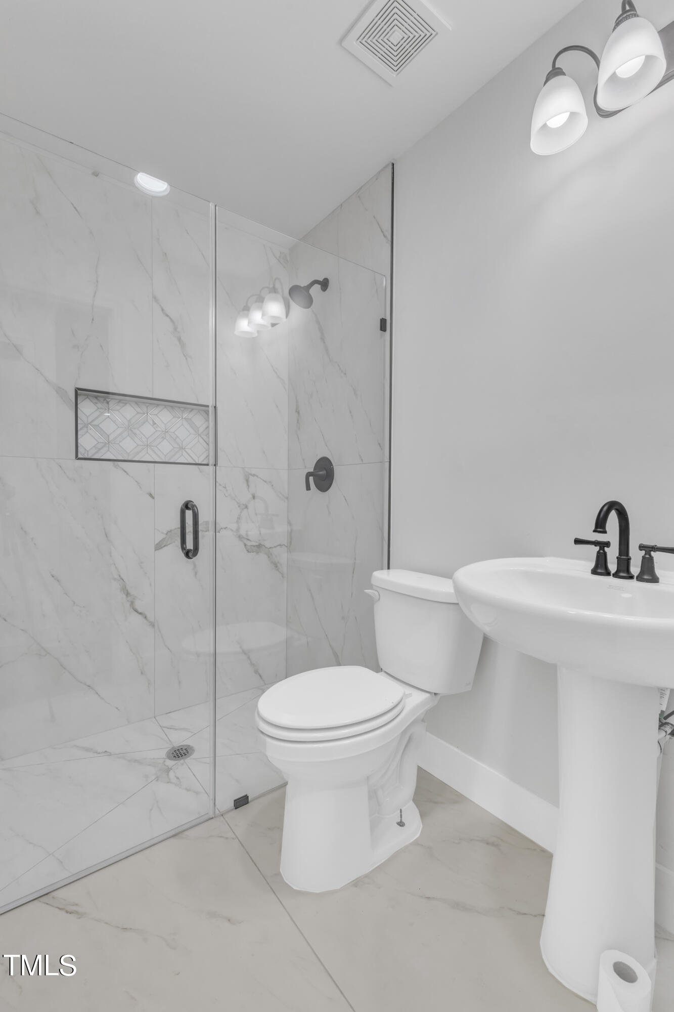Undisclosed Address Raleigh, NC 27615 - Photo 16 of 26 a bathroom with a toilet sink and shower