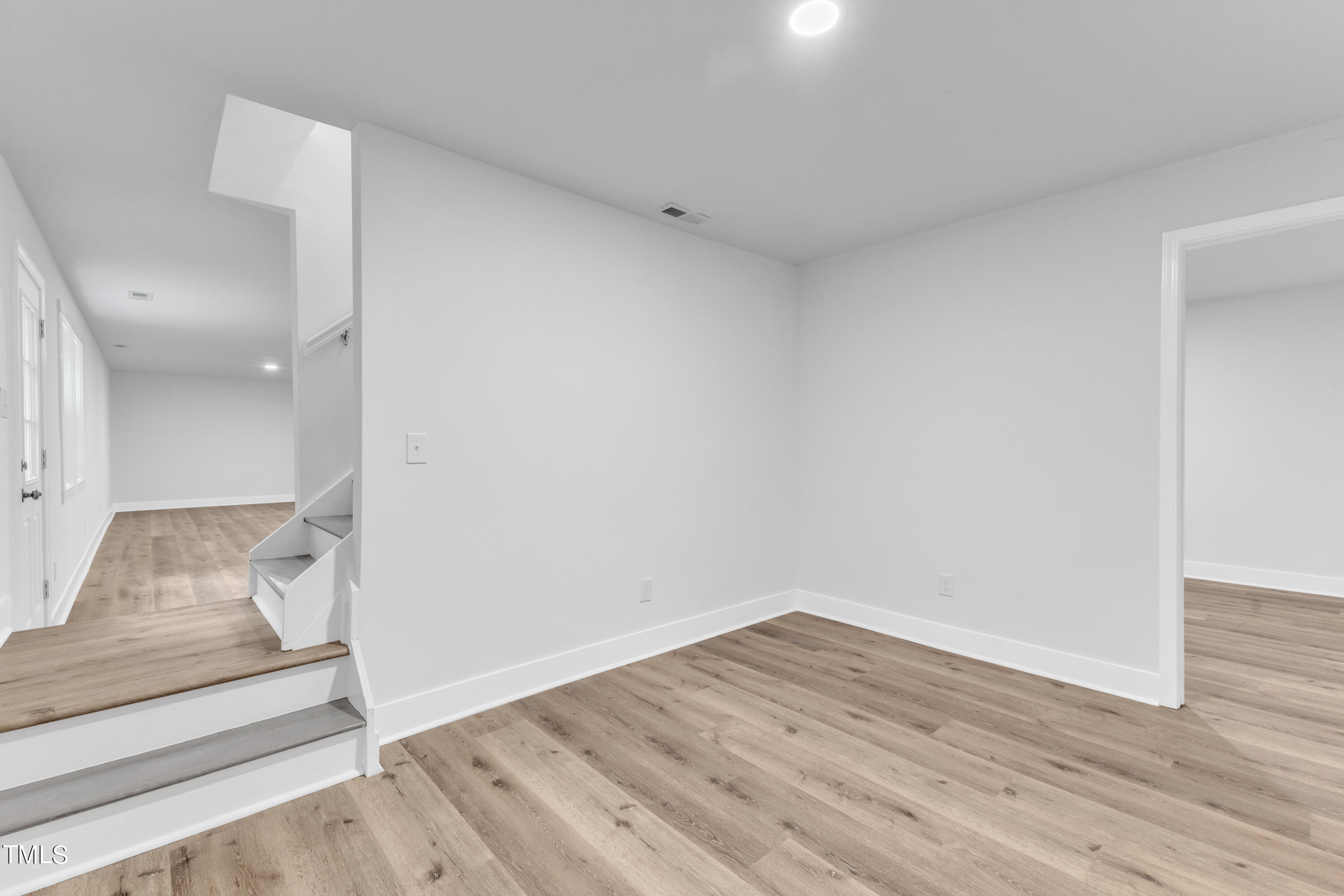 Undisclosed Address Raleigh, NC 27615 - Photo 18 of 26 a view of wooden floor and chair in a room