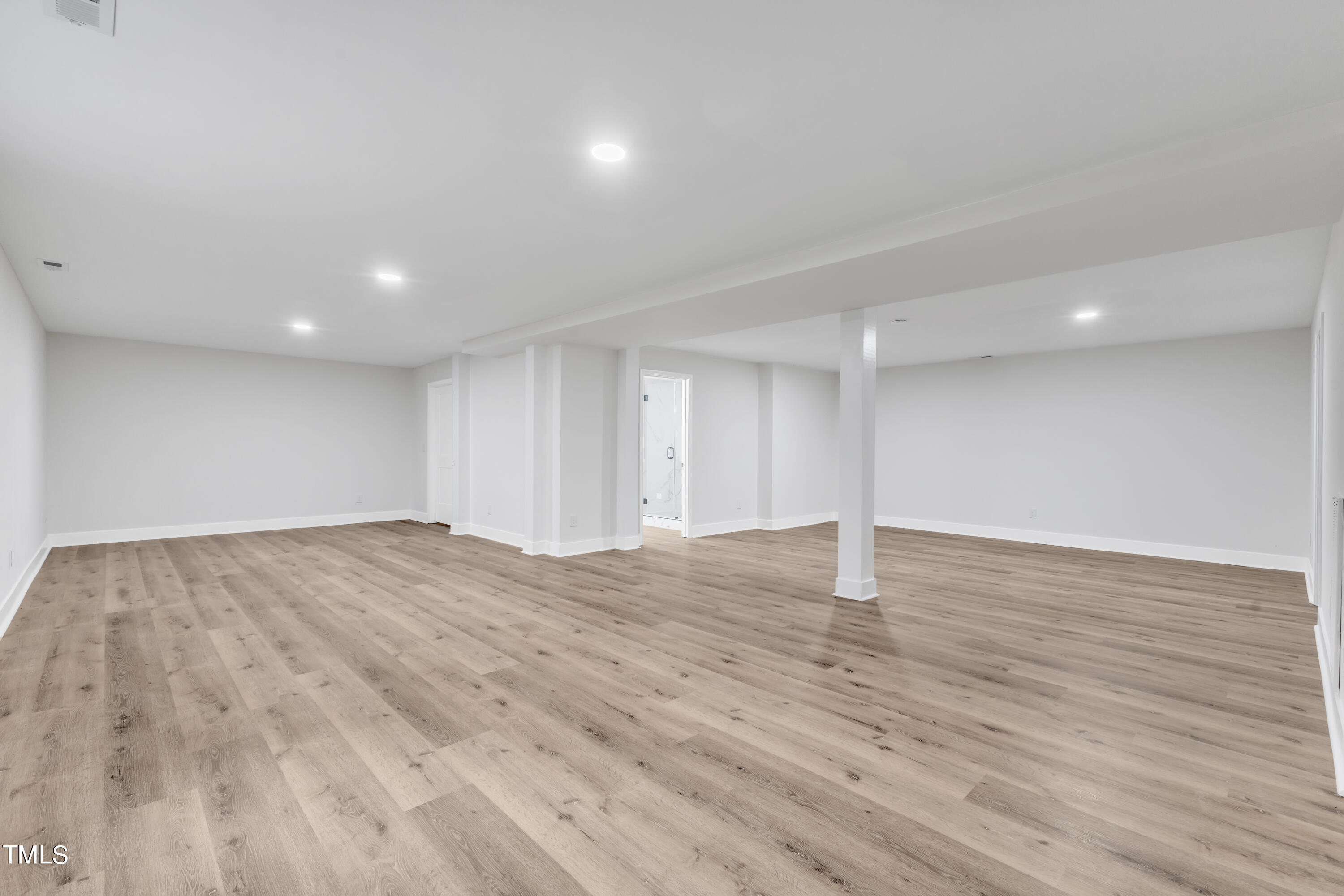 Undisclosed Address Raleigh, NC 27615 - Photo 20 of 26 a view of empty room with wooden floor