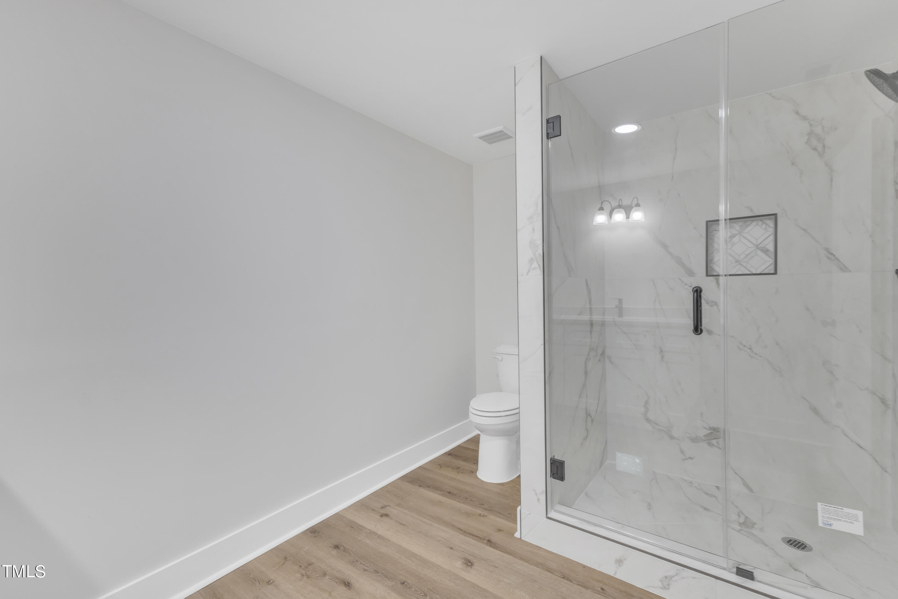Undisclosed Address Raleigh, NC 27615 - Photo 25 of 26 a bathroom with a shower and toilet