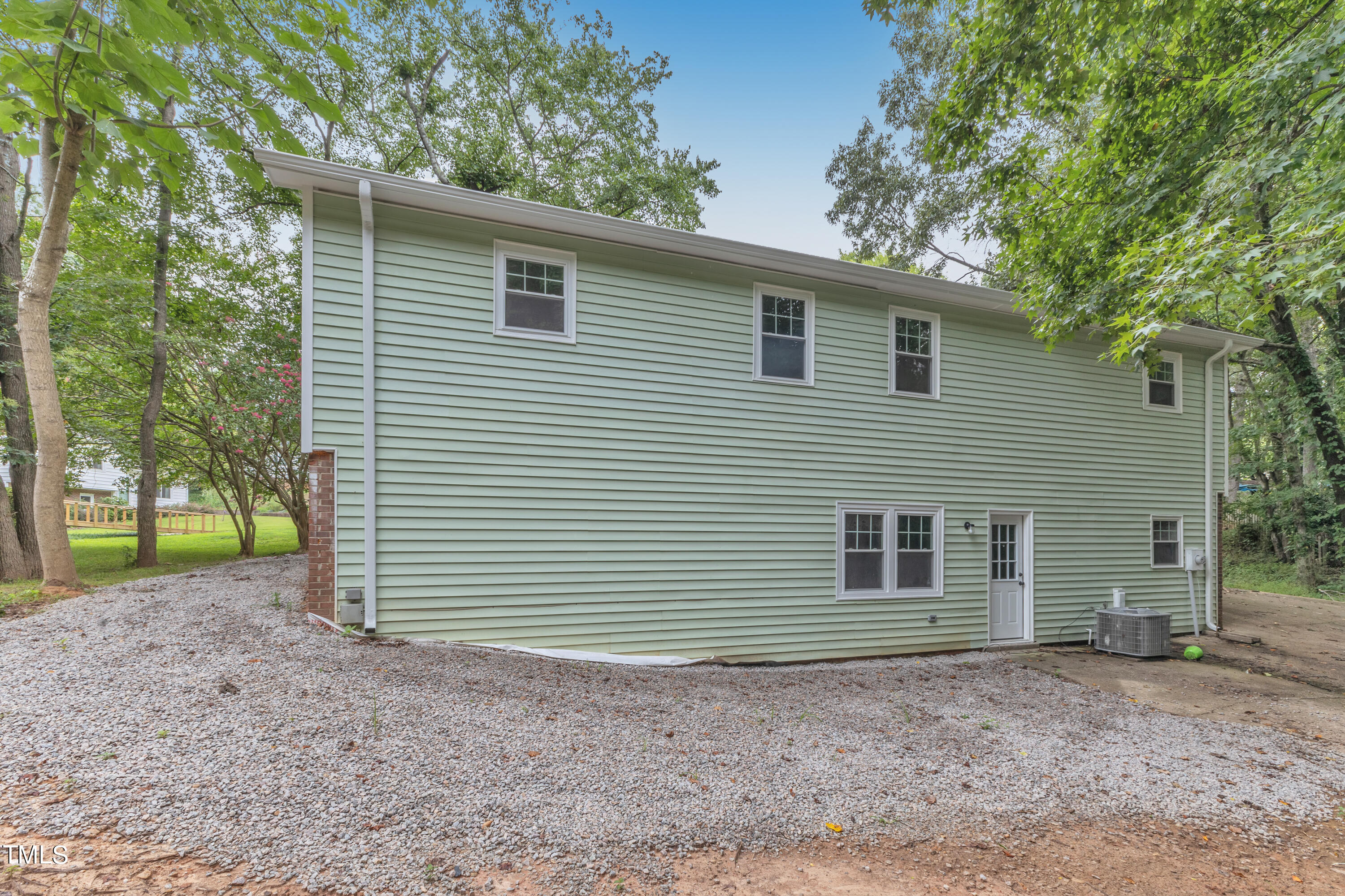 Undisclosed Address Raleigh, NC 27615 - Photo 26 of 26 a front view of a house with a garden