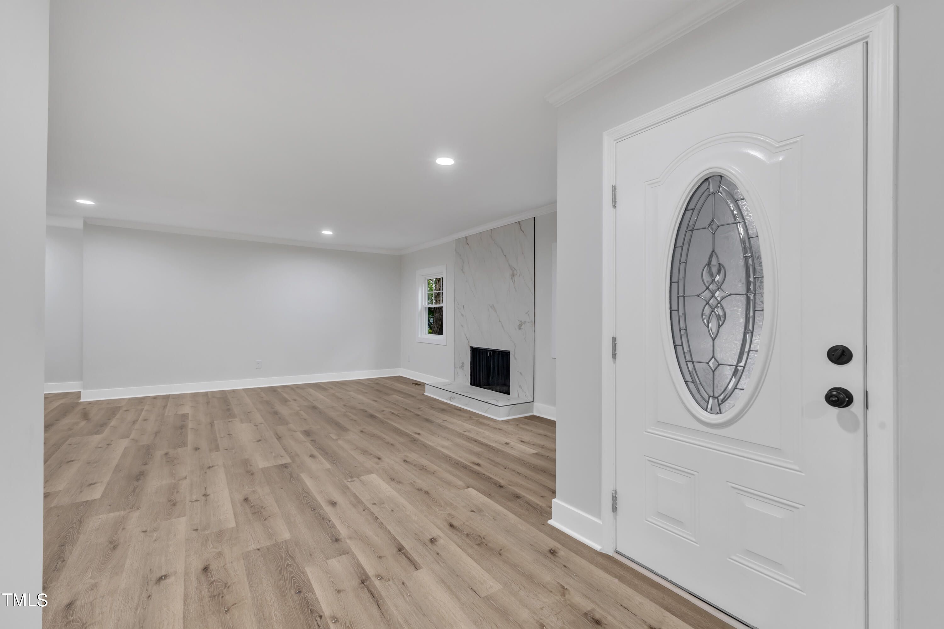 Undisclosed Address Raleigh, NC 27615 - Photo 3 of 26 a view of a livingroom with wooden floor