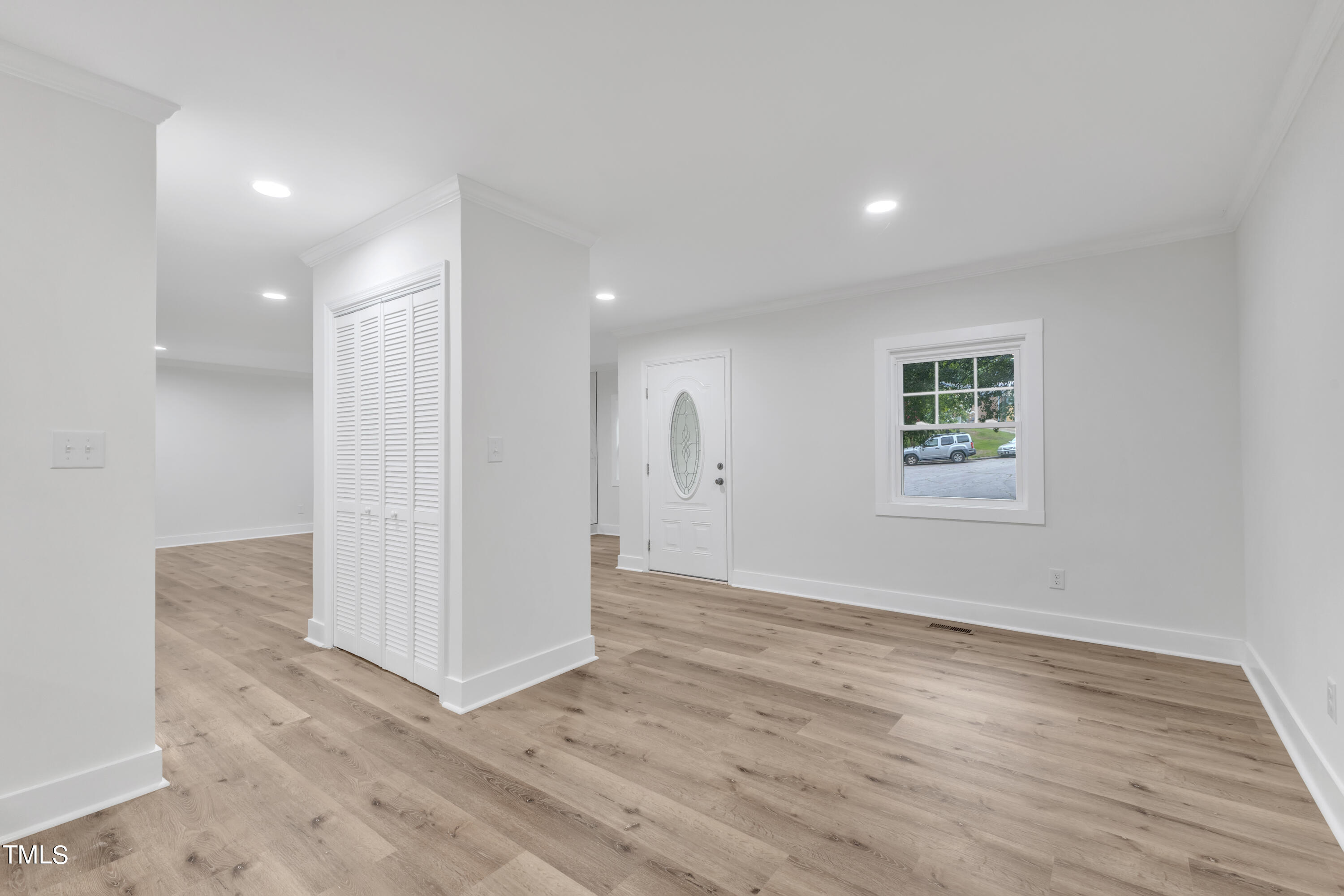 Undisclosed Address Raleigh, NC 27615 - Photo 8 of 26 an empty room with wooden floor and windows