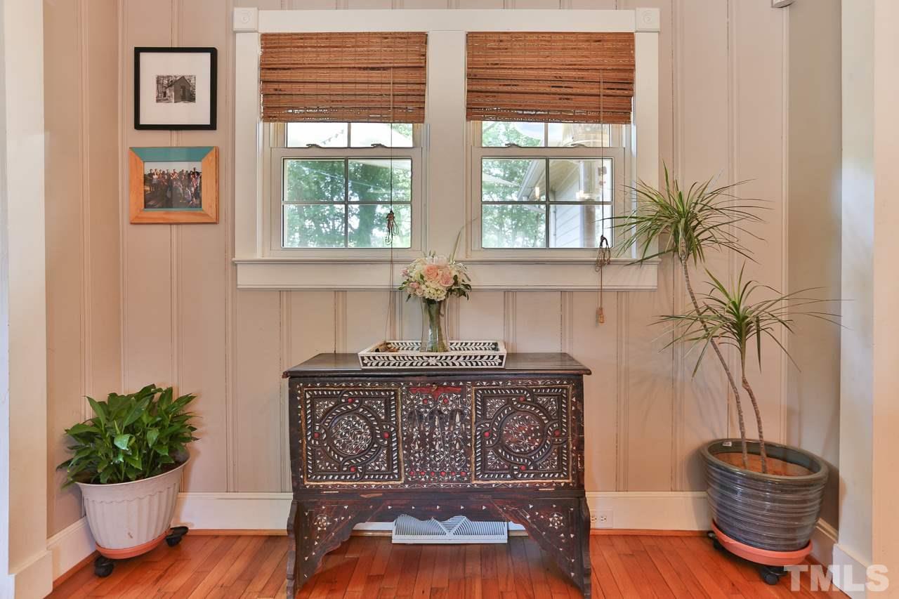 300 East Whitaker Mill Road Raleigh, NC 27608 - Photo 11 of 25 a living room with furniture and a potted plant