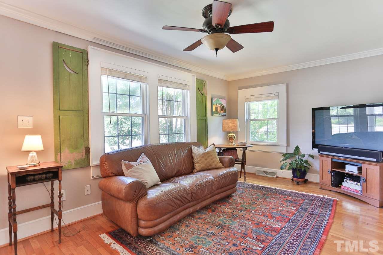 300 East Whitaker Mill Road Raleigh, NC 27608 - Photo 4 of 25 a living room with furniture and a fireplace