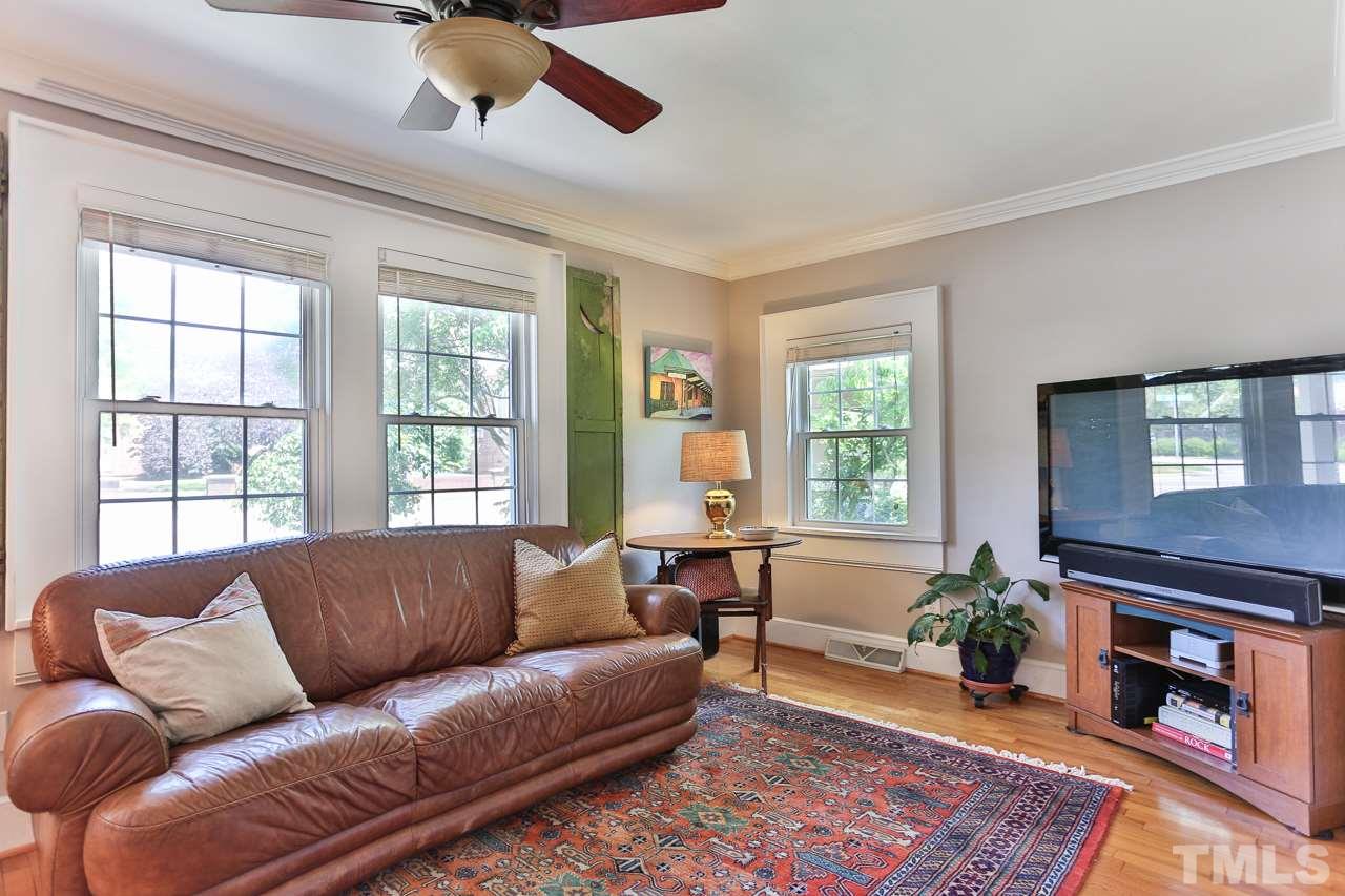 300 East Whitaker Mill Road Raleigh, NC 27608 - Photo 5 of 25 a living room with furniture and a fireplace