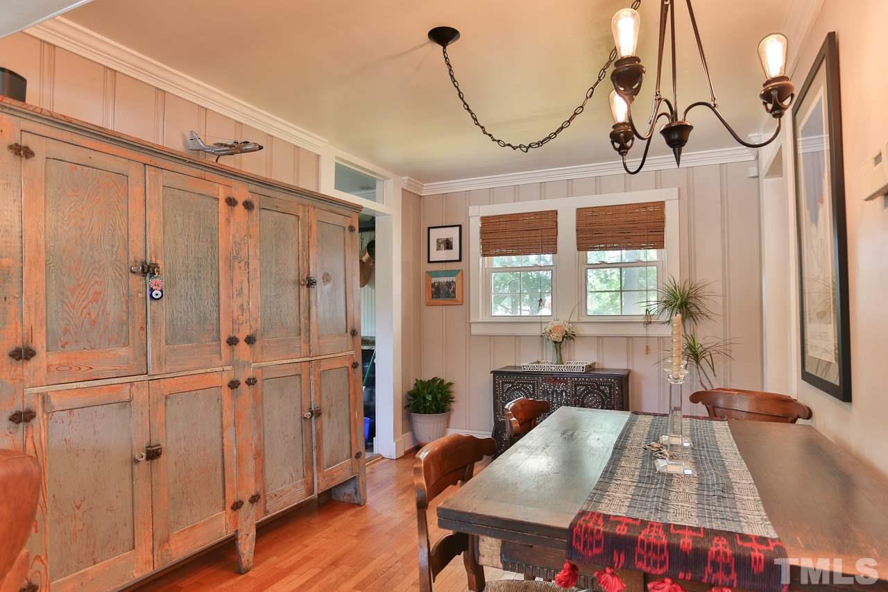 300 East Whitaker Mill Road Raleigh, NC 27608 - Photo 6 of 25 a view of a dining room with furniture window and wooden floor
