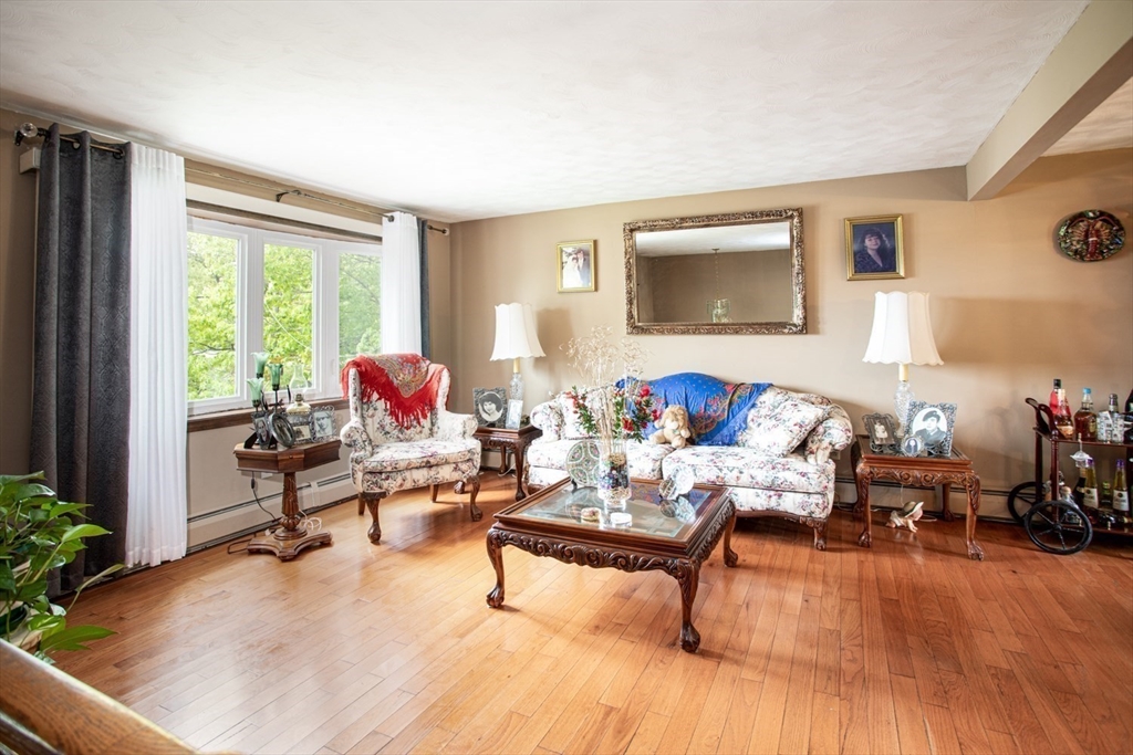 166 Stonehaven Road Fall River, MA 02723 - Photo 4 of 33 a living room with furniture and a wooden floor